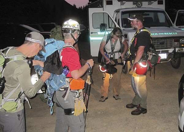 Clallam County Search and Rescue members  prepare to help rescue a hiker at the Tubal Cain Mine Trailhead on Aug. 1.