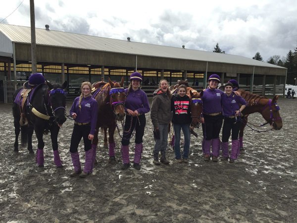 Sequim Equestrian Team members celebrate a win in the Drill Team Freestyle Fours at the second Washington High School Equestrian District 4 meet in Spanaway on Feb. 26.