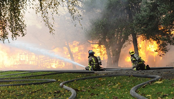 Fire District 3 firefighters look to help quell a fire on Graysmarsh Lane on Oct. 30.