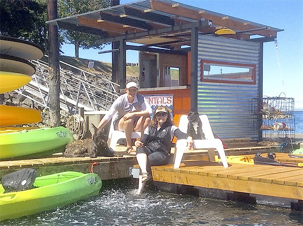 Co-owners Tracie Millett and Lavon Gomes invite families to kayak and paddle board from their refurbished dock on Sequim Bay.