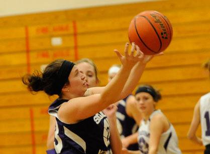 Jordan Miller goes up for a lay-up while practicing Sequim’s new fast-paced offense.