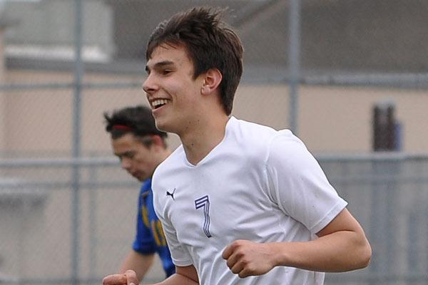 Sequim’s Thomas Winfield is all smiles after knocking home the game-winner Saturday afternoon.