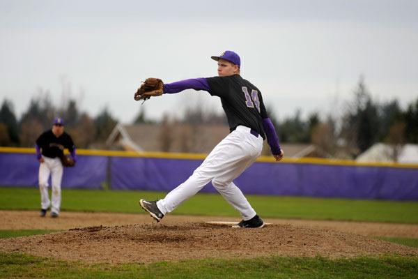Sequim’s Daniel Harker winds up as the Wolves take on Foster on March 18.