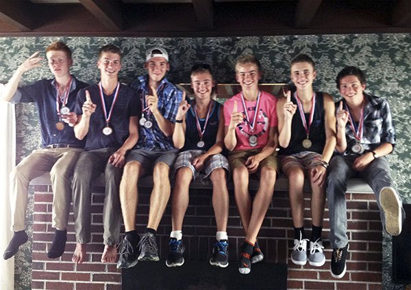 Sequim High’s varsity squad celebrates a big win at the Seaside Three-Course Challenge in Oregon on Saturday. They include