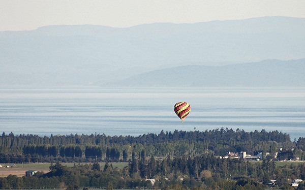 Contributor Deborah Groesbeck spots this hot air balloon soaring over the Sequim-Dungeness Valley on May 3.