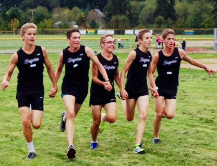 Five way tie for first? You bet. Sequim High’s varsity boys runners share the finish line as they sweep Kingston and Klahowya on Oct. 1. From left is Jackson Oliver