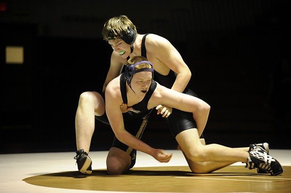 Sequim’s Hunter Davidson (195 pounds) works his way out of a start to earn a 6-2 decision over Klahowya’s John Russel.