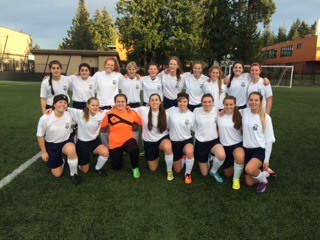 Members of a girls U18 winter league team take a break from practicing as they prep for a 12-game North Puget Sound League soccer season.