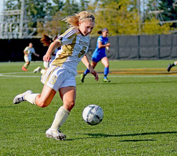 PC’s Ellie Small brings the ball upfield for a shot. Small had a hat trick (three goals) in a 9-1 win against Edmonds on Oct. 14.