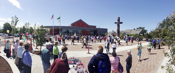 Residents and visitors check out the City of Sequim’s Civic Center and community plaza after a dedication ceremony on June 13. The plaza features a totem pole