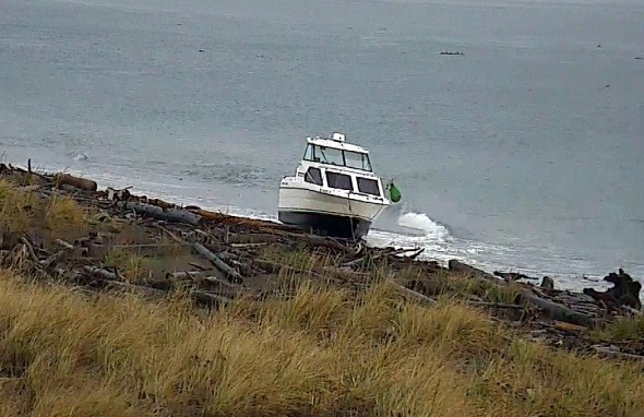Monday evening a 24-foot boat with three men came ashore the Dungeness Spit after the boaters experienced threatening weather conditions.