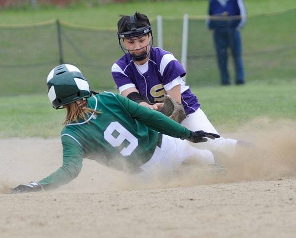 Second baseman Halie Wilson makes a tag on a Roughriders’ runner who tried to steal in the fourth inning. Wolves catcher McKenzie Bentz made the throw.