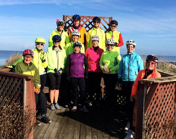 Members of the local bike riding group Women on Wheels (WoW) take a break near 3 Crabs Road as they enjoy a bike-riding day on Nov. 7. Pictured are (back row