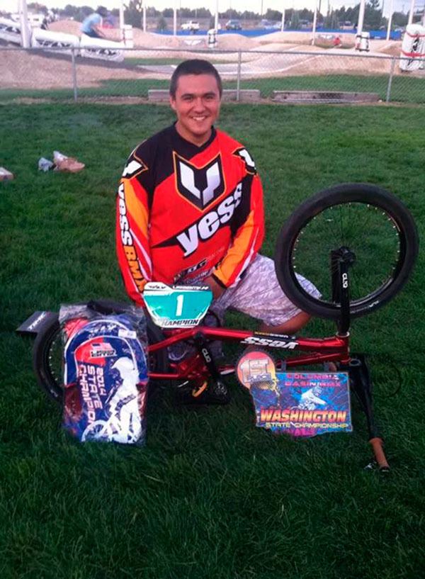 Intermediate rider Jericho Stuntz of Port Angeles celebrates a first-place state championship after successful racing at USA BMX finals in Richland on Aug. 24.