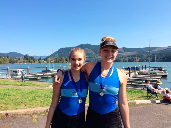 Sequim’s Elise Beuke (right) and Aubree Officer of Port Angeles are all smiles after winning their division (Women’s JV 2x) at the Covered Bridge Regatta on Saturday.