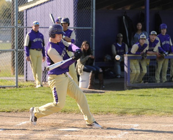 Sequim’s Daniel Harker drives in a run with a sacrifice fly to deep left field in the first inning of an 18-0 rout of Port Townsend on April 16. Harker had two of Sequim’s 16 hits and