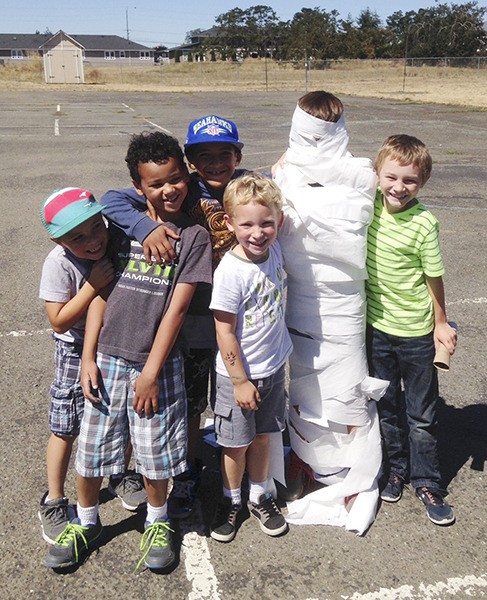 It’s a wrap! The Sequim Boys & Girls Club’s early morning campers show off their mummy-wrapping skills after exploring Egyptian cultures last week.