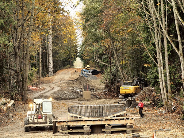 Construction continues on a new trestle spanning the Dungeness River in mid-October. A flood in February damaged the span at Railroad Bridge Park