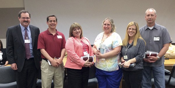 Six Olympic Medical Center employees were recognized for excellence on May 7 during a board meeting. They are from left