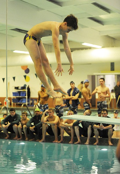 Sequim diver Mathew Craig earns Sequim’s lone first-place finish as the Wolves take on Olympic on Jan. 21 in Port Angeles.