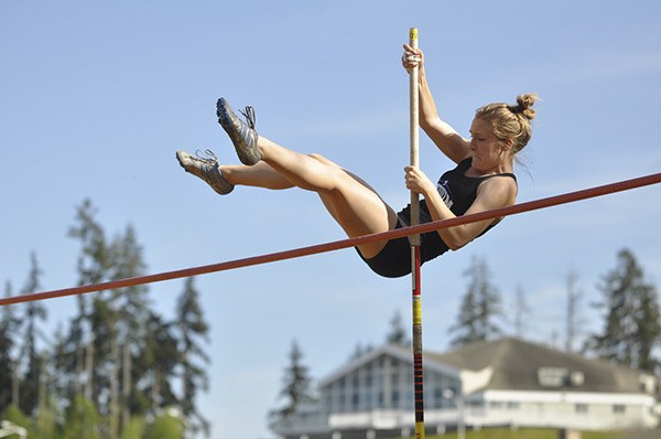 Sequim senior Sarah Hutchison goes up and over the crossbar in the pole vault event as Sequim takes on Olympic and Port Angeles on May 1 at Port Angeles.