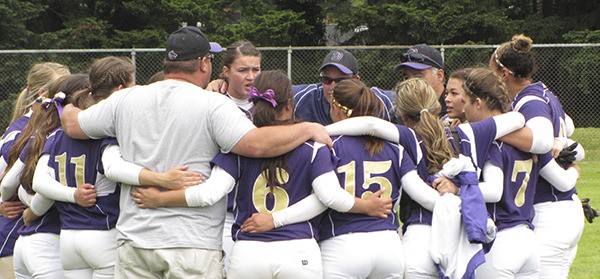 Sequim players confer after knocking off Orting in the West Central District semifinal.