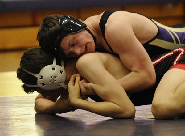 Sequim’s Hayden Gresli grapples with a Port Townsend wrestler as the Wolves take on PT and Port Angeles in a  double-dual meet last week. Gresli placed second at the Keigen Langholff tournament at Klahowya Saturday