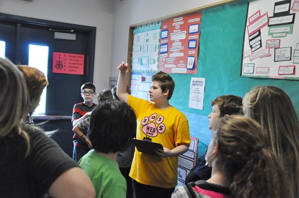 Eighth-grade WEB leader Mazie Whitteker shows a group of Greywolf fifth-graders around the sixth-grade wing at Sequim Middle School. Fifth-graders from both elementary schools took a tour of the middle school in preparation for the fall transition to sixth grade.