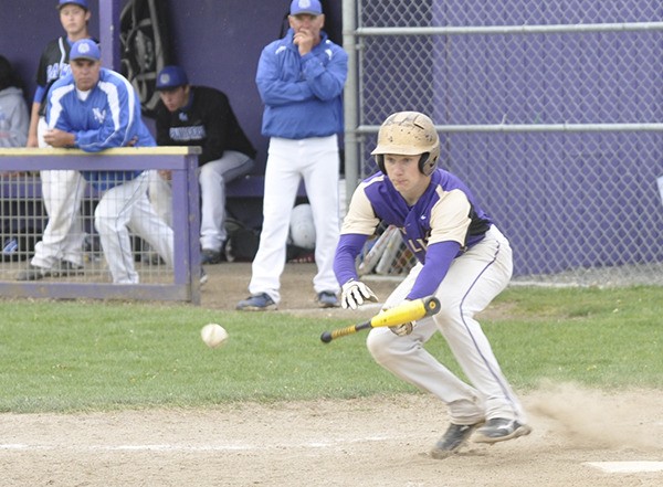 Sequim’s Brett Wright attempts a bunt to advance a baserunner as Sequim takes on North Mason on May 2.