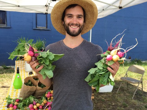 Daniel Shuman of Westwind Farm brings fresh produce to the Sequim Farmers Market.