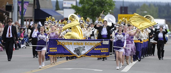 Sequim High School marching ban plays at the Sequim Irrigation Festival's Grand Parade.