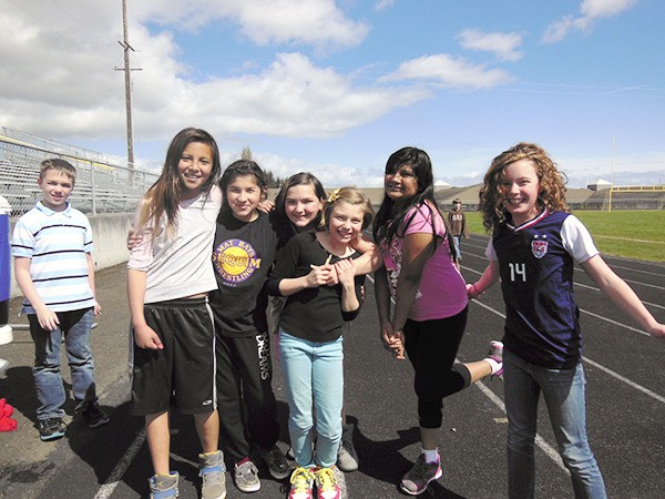 Rachel Oden’s fifth-graders take a break in competing in the Helen Haller Elementary Jog-a-thon. From left are Ayrthon Clites