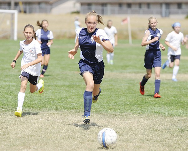 Olivia Hare of Storm King GU13 races downfield as her team takes on West Narrows GU13 02 Blue on Sunday