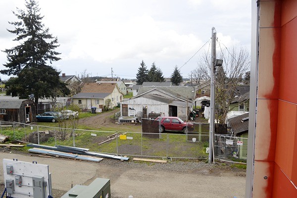 The view from the Sequim Civic Center’s patio overlooks nearby properties on Spruce Street that have had 144 incidents reported to law enforcement from 2010-2014. City officials broke off negotiations recently to rent the properties for parking due to a failure to find a mutual lease agreement with the properties’ owner.