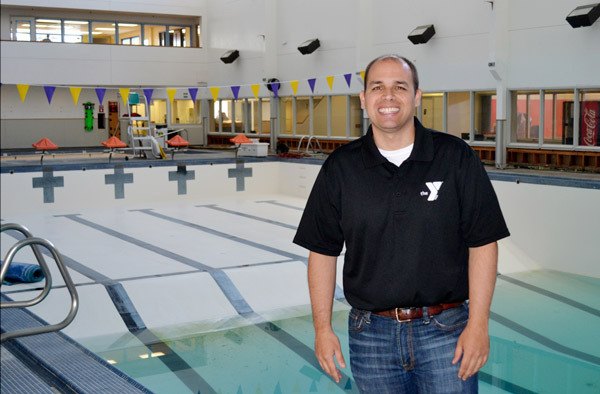 New branch manager Kurt Turner stands by the nearly empty YMCA of Sequim’s pool. Turner recently was hired from Texas to lead the facility