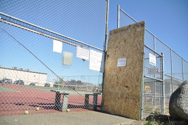 Cracks and an uneven playing surface remain on the lower tennis courts at Sequim High School. School officials shut down two of the five courts for safety reasons last week.