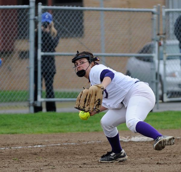 Olivia Kirsch digs deep at third base to make a play at first base.