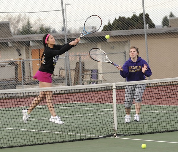 Cheyenne Sokkappa and Katelyn Wake work together to return a hit in a game during practice. Sokkappa is one of two returning seniors and will play as the Wolves’ No. 1 singles player to start the season.