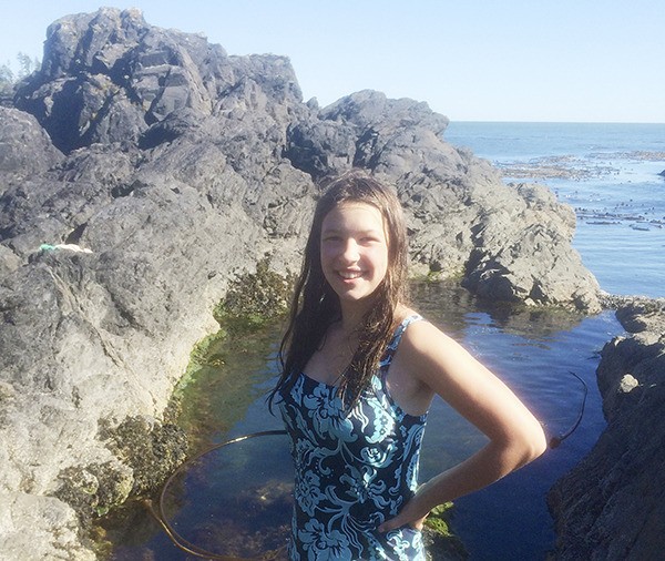 Mia Underwood of Sequim stands by the rocks and tide pools on a visit to Ucluelet