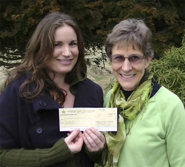 Joy Sheedy of the Port Angeles Chapter IV of PEO presented Angela Dawn Graham with a $1