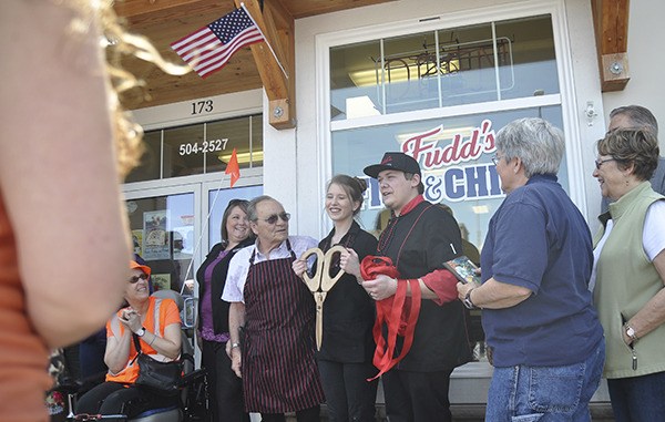 Taking a short break for an official ribbon cutting for the Sequim-Dungeness Valley Chamber of Commerce are Louie Rychlik