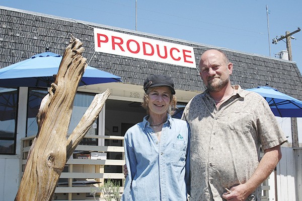 Peninsula Produce owners Sali and Rob Capelle stand outside their new produce store on a sunny July afternoon two weeks after the store opened in mid-June.