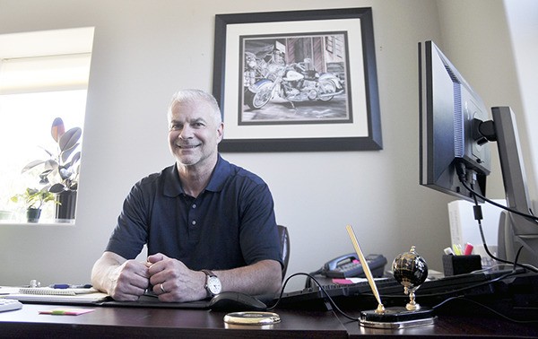 Gary Neal sits in his office a few weeks after starting his assistant superintendent position in July 2014.
