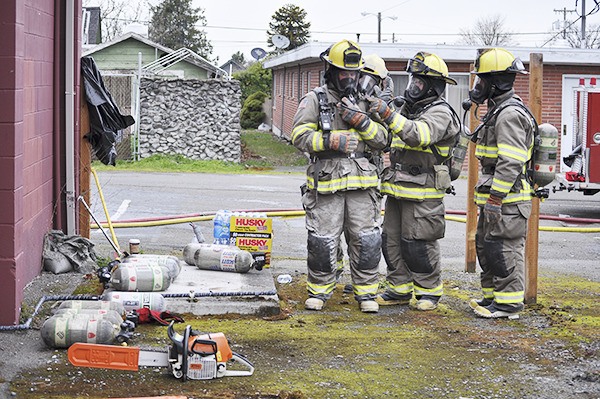 Recruits for Clallam County Fire District 3 prepare for training their firefighting and rescue techniques at the former Sequim City Hall building in March of 2014.
