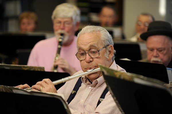 Collis Massey plays the flute at a recent rehearsal of the Sequim City Band.