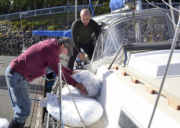 Sid Maroney and Erden Eruc load up the boat Ya Shure to sail Nash’s Organic Produce grain and flour to Sundance Bakery on Whidbey Island. It’s the first time in three years that Nash’s has partnered with the Salish Sea Trading Cooperative.