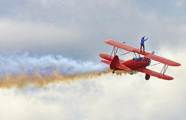 Mike and Marilyn Mason of West Coast Spin Doctors wow the crowd on Aug. 30 as they do a wing walking demonstration during the Olympic Peninsula Air Affaire. On Sunday
