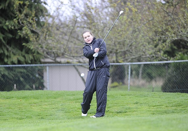 Kailee Price shoots for the green at the Cedars at Dungeness on April 8. She and her teammates remain undefeated in Olympic League play so far this season after defeating North Kitsap and North Mason last week.
