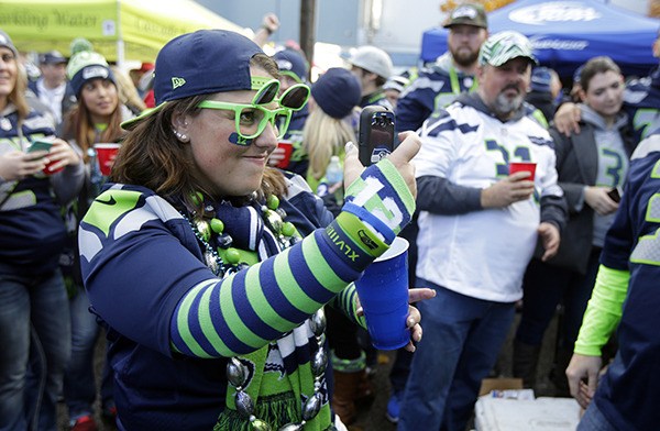 Seattle Seahawks fans yell in the first half of the game against the Arizona Cardinals on Nov. 23 in Seattle.