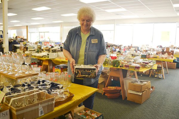 Marilyn Zimmerman sorts glassware for the Shipley Center’s Ninth Annual Shipley Center Benefit Sale. Volunteers still seek donations for the sale going Aug. 7-9 at the QFC Shopping Center.